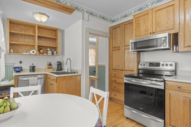 169 Peck Ave, West Haven, CT 06516 - kitchen featuring appliances with stainless steel finishes, light wood finished floors, light countertops, and open shelves