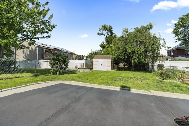 169 Peck Ave, West Haven, CT 06516 - fenced backyard with a shed and a patio