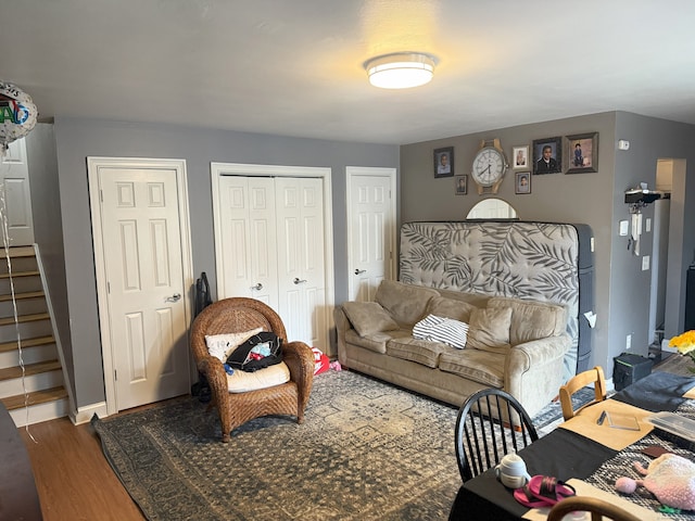 38 Padanaram Ave Unit 24, Danbury, CT 06811 - living area featuring dark wood-style floors and stairs