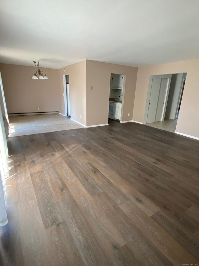 255 Strawberry Hill Ave Unit D4, Stamford, CT 06902 - empty room with wood finished floors and a baseboard radiator