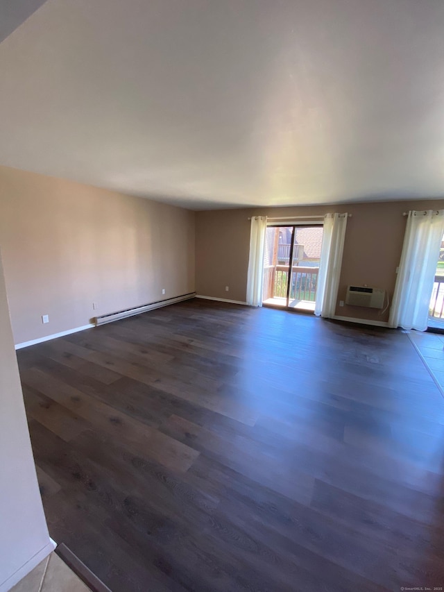 255 Strawberry Hill Ave Unit D4, Stamford, CT 06902 - unfurnished living room featuring baseboard heating, dark wood-type flooring, and a wall mounted air conditioner
