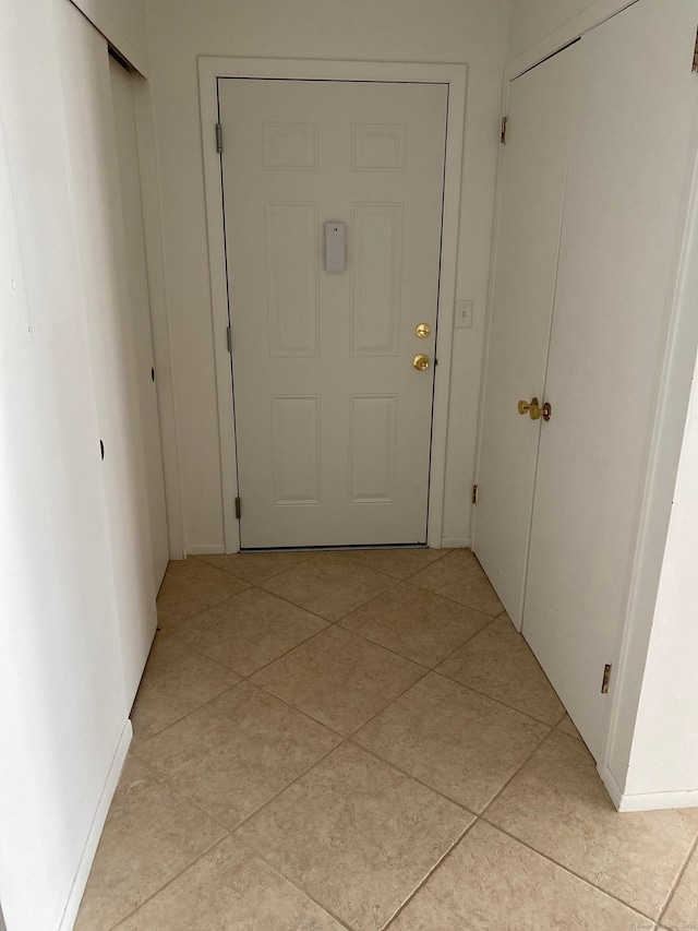 255 Strawberry Hill Ave Unit D4, Stamford, CT 06902 - hall featuring light tile patterned flooring and baseboards