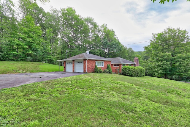 259 Allen St, Plymouth, CT 06786 - ranch-style house featuring driveway, brick siding, a front yard, a chimney, and an attached garage