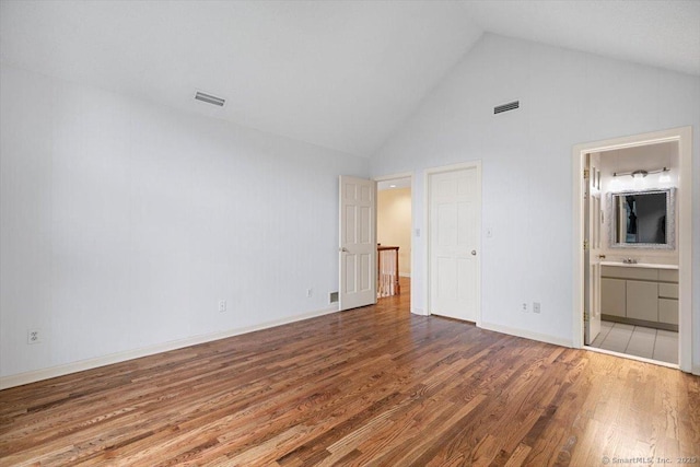 1 Mountaincrest Dr, Cheshire, CT 06410 - unfurnished bedroom with wood finished floors, high vaulted ceiling, and connected bathroom