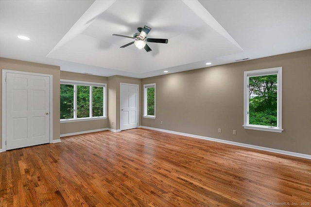 1 Mountaincrest Dr, Cheshire, CT 06410 - empty room featuring ceiling fan, healthy amount of natural light, wood finished floors, a raised ceiling, and recessed lighting