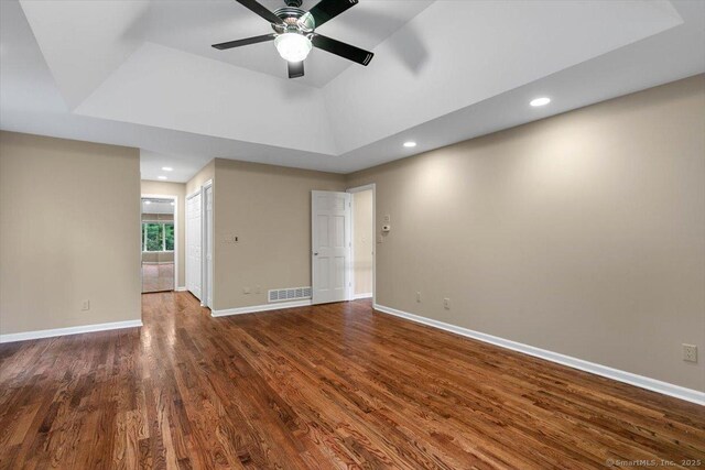 1 Mountaincrest Dr, Cheshire, CT 06410 - spare room with dark wood-style flooring, ceiling fan, recessed lighting, and a tray ceiling