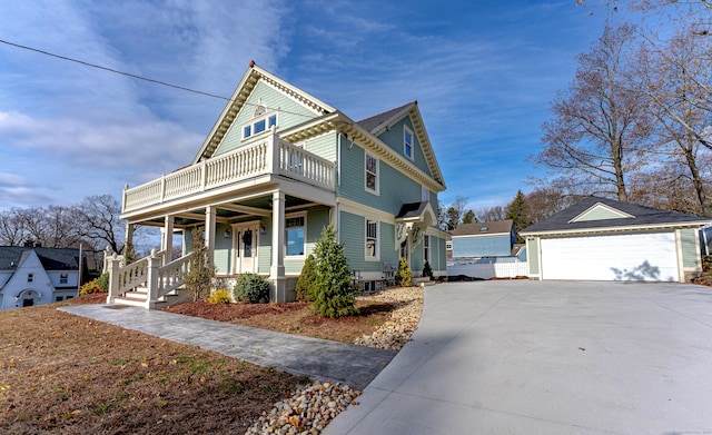 193 Woodland St, Bristol, CT 06010 - victorian-style house with a garage, covered porch, an outbuilding, and a balcony
