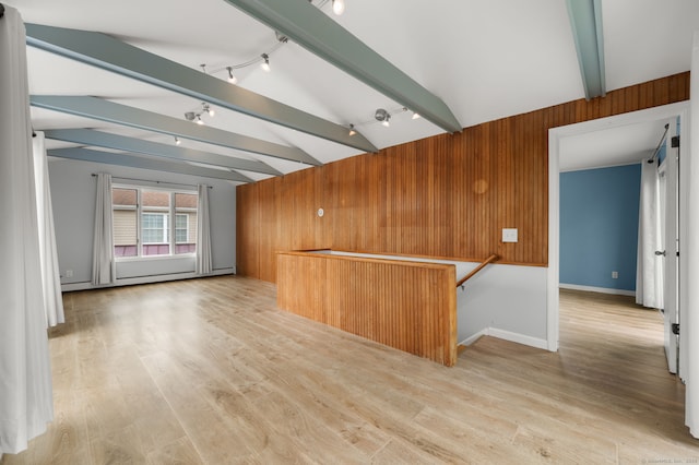 8 Griswold Dr, East Lyme, CT 06357 - unfurnished room featuring rail lighting, wooden walls, and light wood-style floors