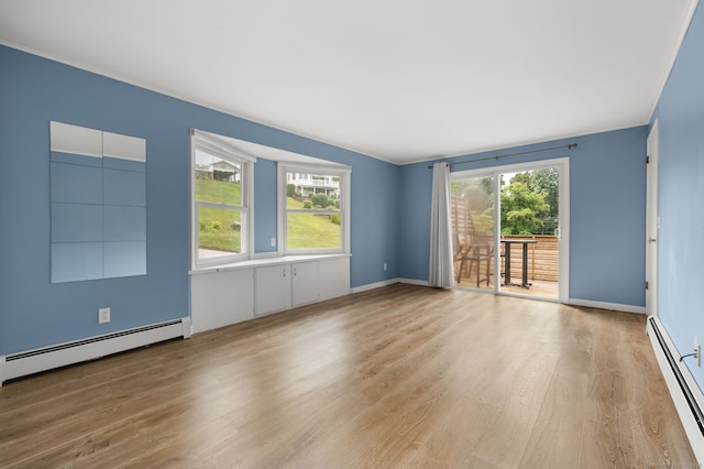 8 Griswold Dr, East Lyme, CT 06357 - spare room with baseboard heating and wood finished floors