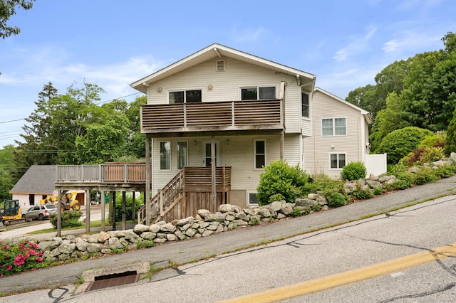 8 Griswold Dr, East Lyme, CT 06357 - view of front of house featuring a balcony and stairs