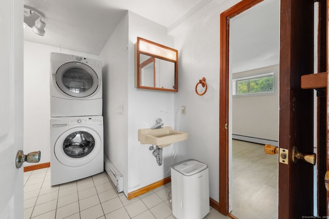 8 Griswold Dr, East Lyme, CT 06357 - washroom with stacked washer / drying machine, a baseboard radiator, baseboard heating, and light tile patterned floors