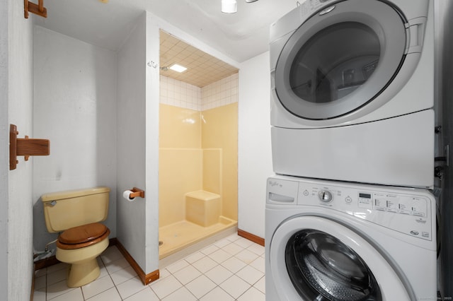 8 Griswold Dr, East Lyme, CT 06357 - washroom featuring stacked washer and clothes dryer and light tile patterned floors