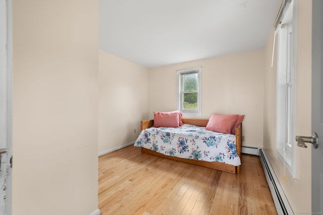 8 Griswold Dr, East Lyme, CT 06357 - bedroom featuring baseboard heating and wood finished floors