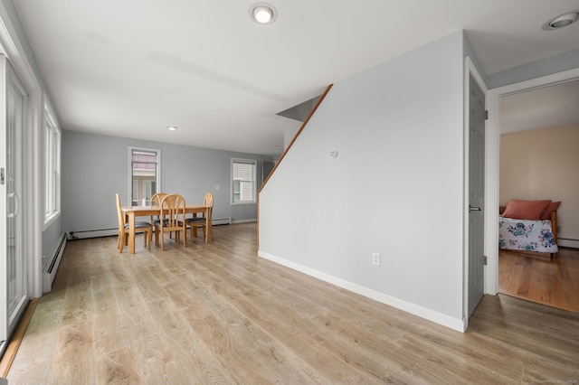 8 Griswold Dr, East Lyme, CT 06357 - dining space with light wood finished floors and stairs