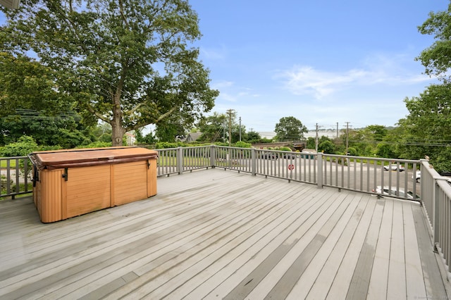 8 Griswold Dr, East Lyme, CT 06357 - wooden terrace featuring a hot tub and view of wooded area