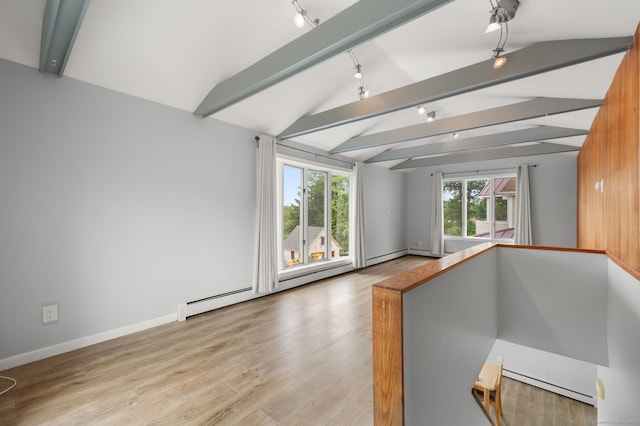8 Griswold Dr, East Lyme, CT 06357 - unfurnished living room featuring rail lighting, wood finished floors, and a baseboard radiator