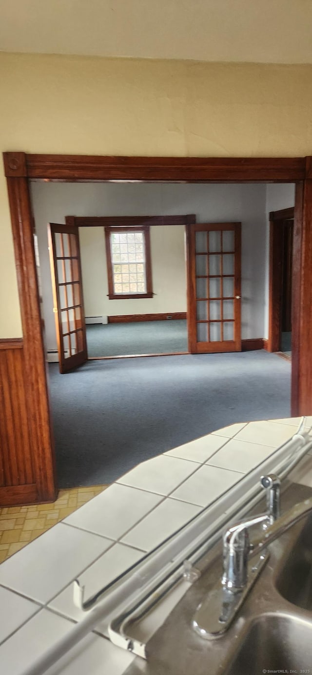 36 Connecticut Mills Ave, Killingly, CT 06239 - hallway with light carpet and baseboard heating