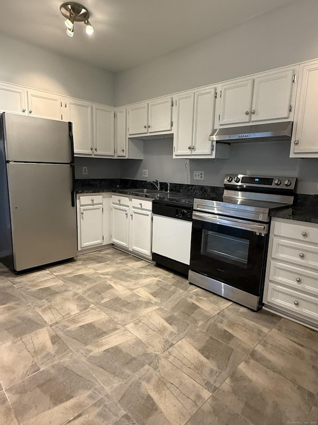 13 Hills Ln Unit 13, Westport, CT 06880 - kitchen with stainless steel appliances, under cabinet range hood, white cabinetry, and dark countertops