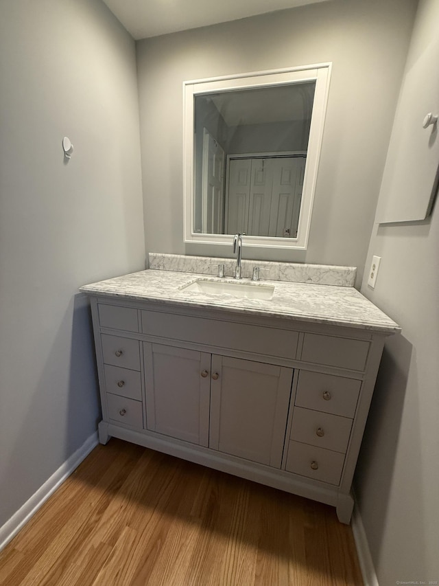 13 Hills Ln Unit 13, Westport, CT 06880 - bathroom featuring wood finished floors and vanity