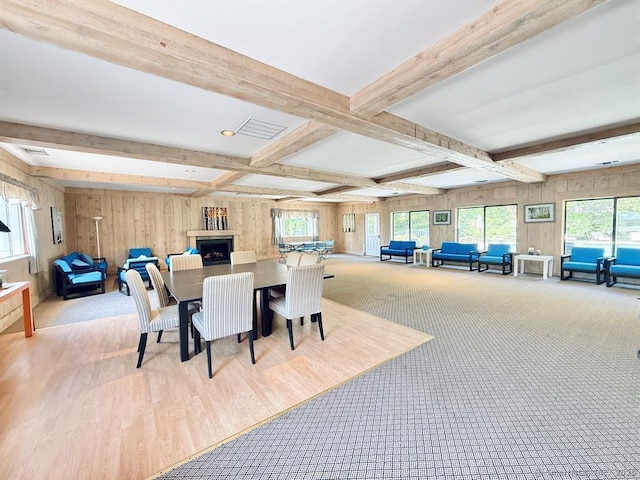 13 Hills Ln Unit 13, Westport, CT 06880 - dining space featuring beam ceiling, wood walls, wood finished floors, and coffered ceiling