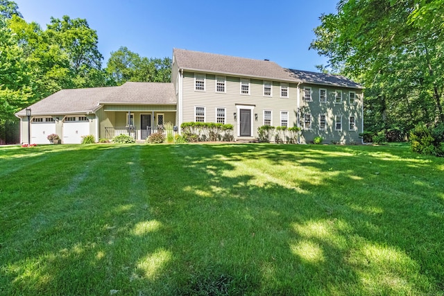 10 Brian Dr, Hebron, CT 06248 - colonial home with a front yard, a garage, and roof with shingles