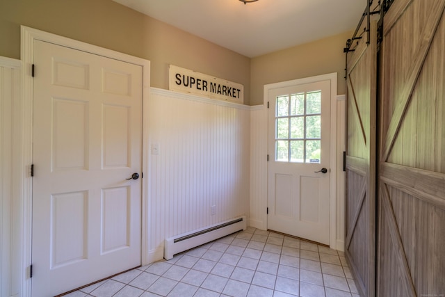 10 Brian Dr, Hebron, CT 06248 - doorway to outside with a baseboard radiator, a barn door, wainscoting, and light tile patterned floors