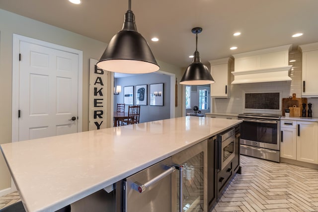 10 Brian Dr, Hebron, CT 06248 - kitchen with stainless steel appliances, wine cooler, light countertops, decorative backsplash, and white cabinets