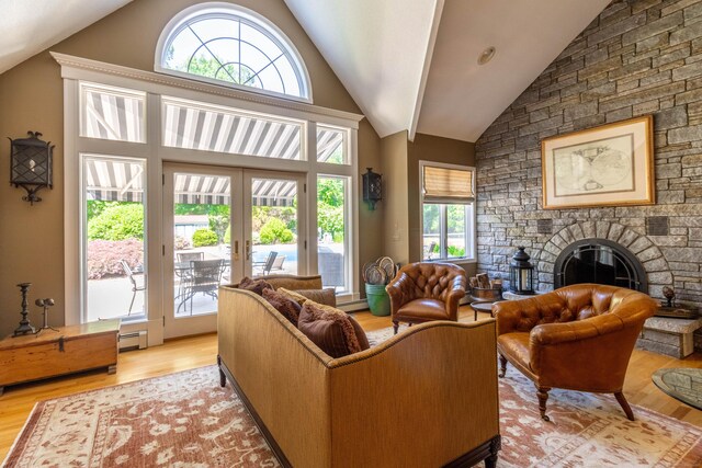 10 Brian Dr, Hebron, CT 06248 - living room featuring vaulted ceiling, plenty of natural light, light wood finished floors, and french doors