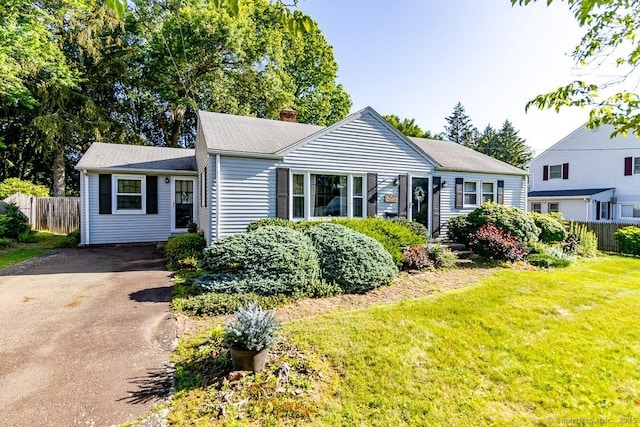39 Mohawk Ln, Wethersfield, CT 06109 - view of front of home with a chimney and driveway