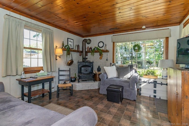 39 Mohawk Ln, Wethersfield, CT 06109 - living room with wood ceiling, healthy amount of natural light, a wood stove, and stone finish floors