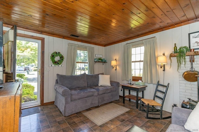 39 Mohawk Ln, Wethersfield, CT 06109 - living area with plenty of natural light, dark stone finish flooring, and wood ceiling