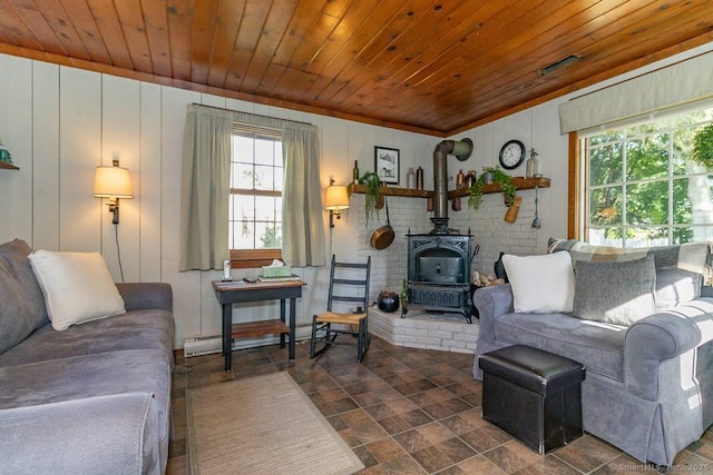 39 Mohawk Ln, Wethersfield, CT 06109 - living room with wooden ceiling, a wood stove, baseboard heating, dark stone finish floors, and crown molding