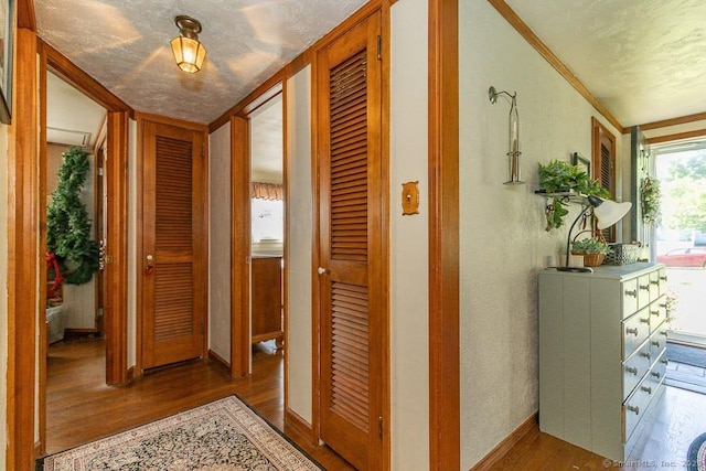 39 Mohawk Ln, Wethersfield, CT 06109 - hall with wood finished floors and crown molding