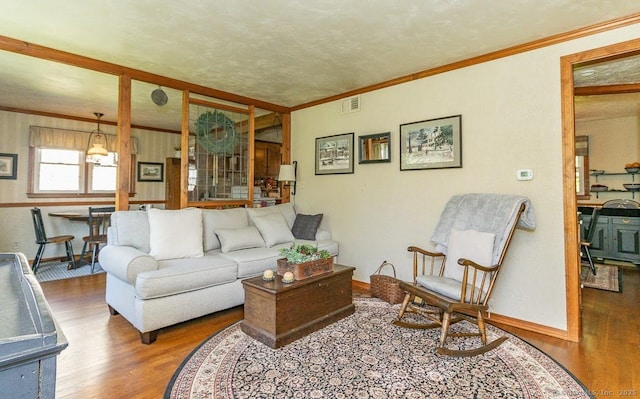 39 Mohawk Ln, Wethersfield, CT 06109 - living room featuring wood finished floors and ornamental molding