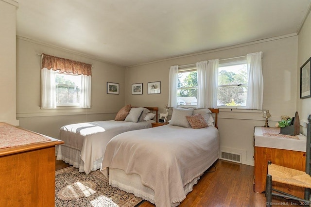 39 Mohawk Ln, Wethersfield, CT 06109 - bedroom featuring dark wood-type flooring, multiple windows, and crown molding