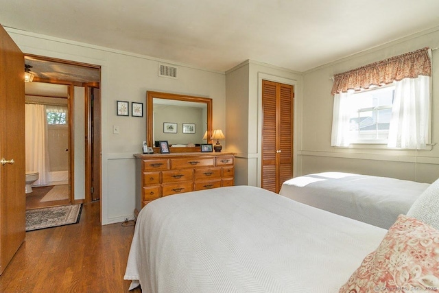 39 Mohawk Ln, Wethersfield, CT 06109 - bedroom with dark wood-style floors and a closet