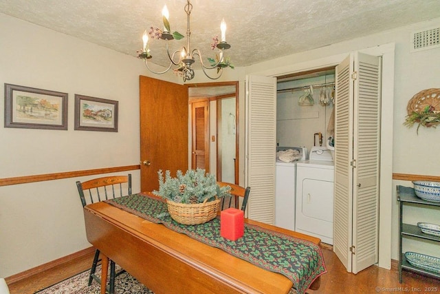 39 Mohawk Ln, Wethersfield, CT 06109 - dining area with independent washer and dryer, a chandelier, and a textured ceiling