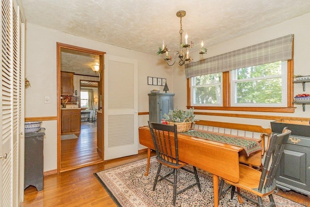 39 Mohawk Ln, Wethersfield, CT 06109 - dining room with a chandelier and light wood finished floors