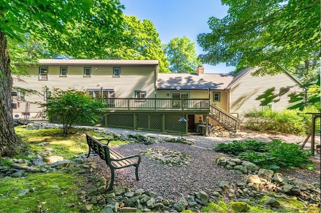 135 Harvest Woods Rd, Middlefield, CT 06481 - rear view of property with stairs, a deck, and a chimney