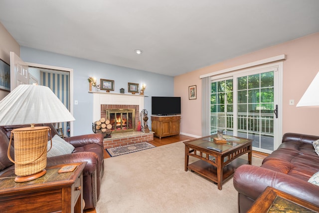135 Harvest Woods Rd, Middlefield, CT 06481 - living area featuring a brick fireplace, wood finished floors, and recessed lighting