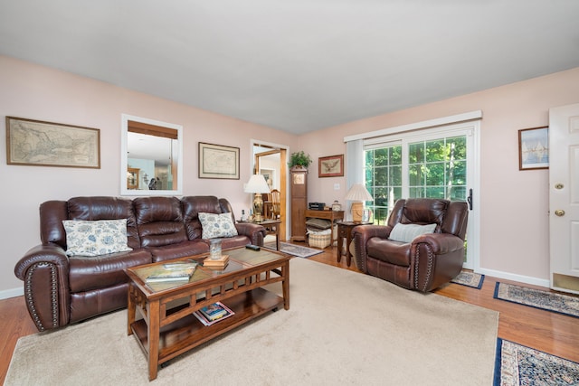 135 Harvest Woods Rd, Middlefield, CT 06481 - living area with wood finished floors and baseboards