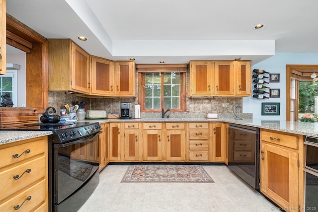 135 Harvest Woods Rd, Middlefield, CT 06481 - kitchen featuring black electric range oven, recessed lighting, light stone counters, backsplash, and beverage cooler