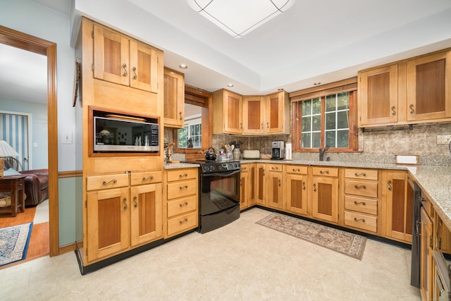 135 Harvest Woods Rd, Middlefield, CT 06481 - kitchen with electric range, stainless steel microwave, tasteful backsplash, light stone countertops, and recessed lighting
