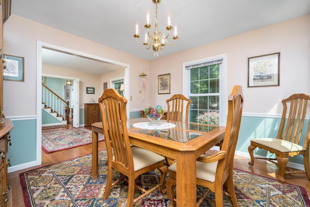 135 Harvest Woods Rd, Middlefield, CT 06481 - dining area featuring a chandelier and wood finished floors