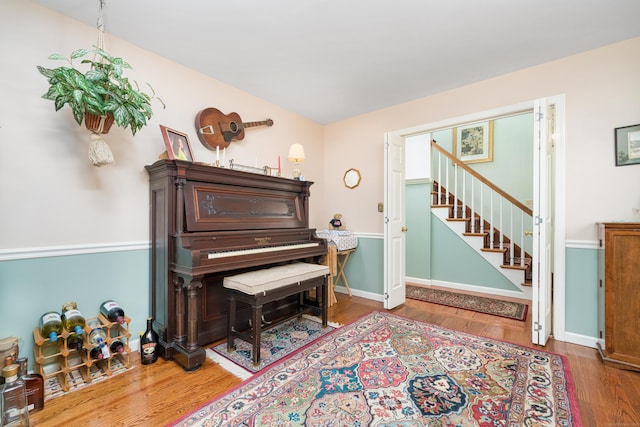 135 Harvest Woods Rd, Middlefield, CT 06481 - sitting room with stairs and wood finished floors