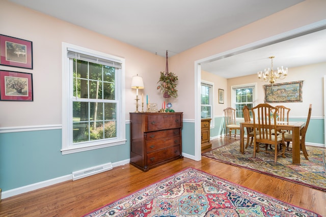 135 Harvest Woods Rd, Middlefield, CT 06481 - dining area featuring a chandelier and wood finished floors