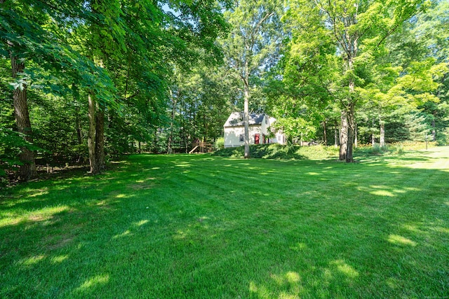 135 Harvest Woods Rd, Middlefield, CT 06481 - view of green lawn with a forest view