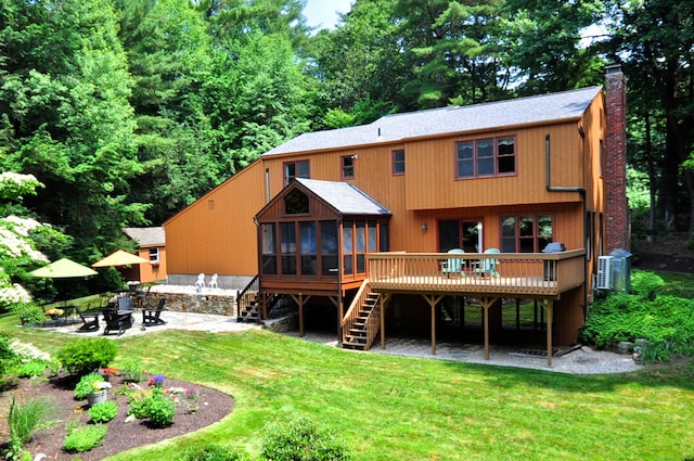 11 Brianwood Ln, Granby, CT 06035 - back of house with stairs, an outdoor fire pit, a sunroom, a deck, and a patio area