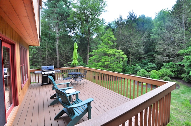 11 Brianwood Ln, Granby, CT 06035 - wooden deck with outdoor dining space, area for grilling, and a view of trees