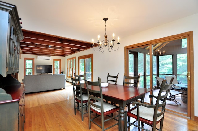 11 Brianwood Ln, Granby, CT 06035 - dining room featuring a wall unit AC, plenty of natural light, a chandelier, light wood-type flooring, and beamed ceiling
